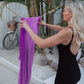 Candice hanging magenta BEST CELLF towel on clothes line